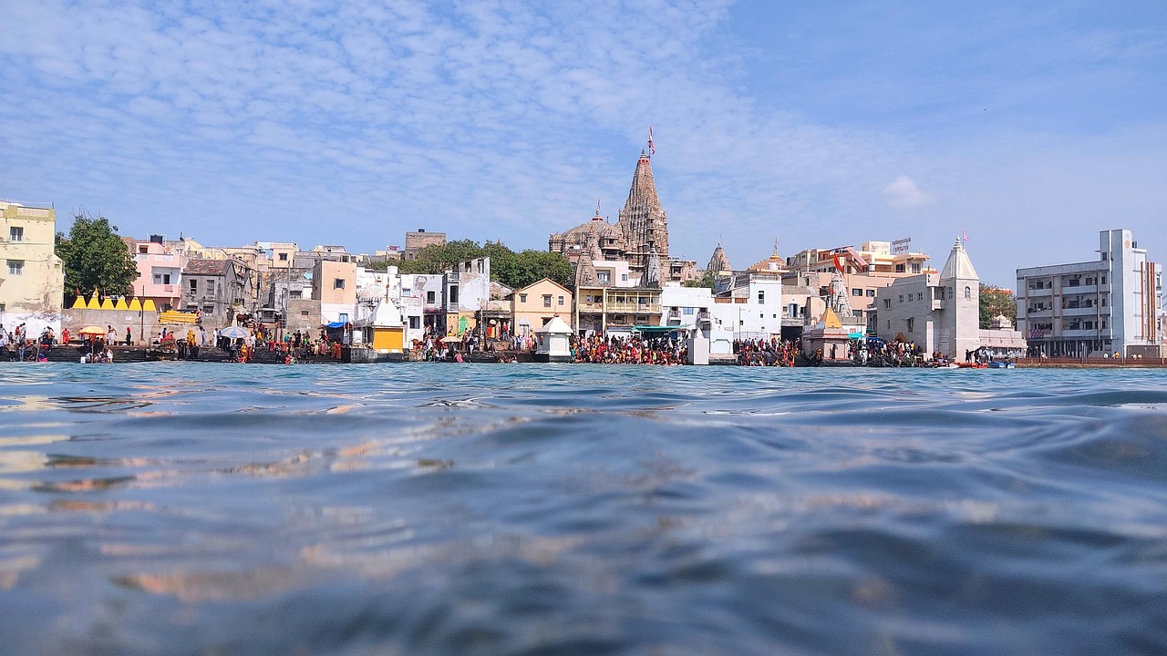 Gomti Ghat, Dwarka, with the Dwarkadhish Temple spire