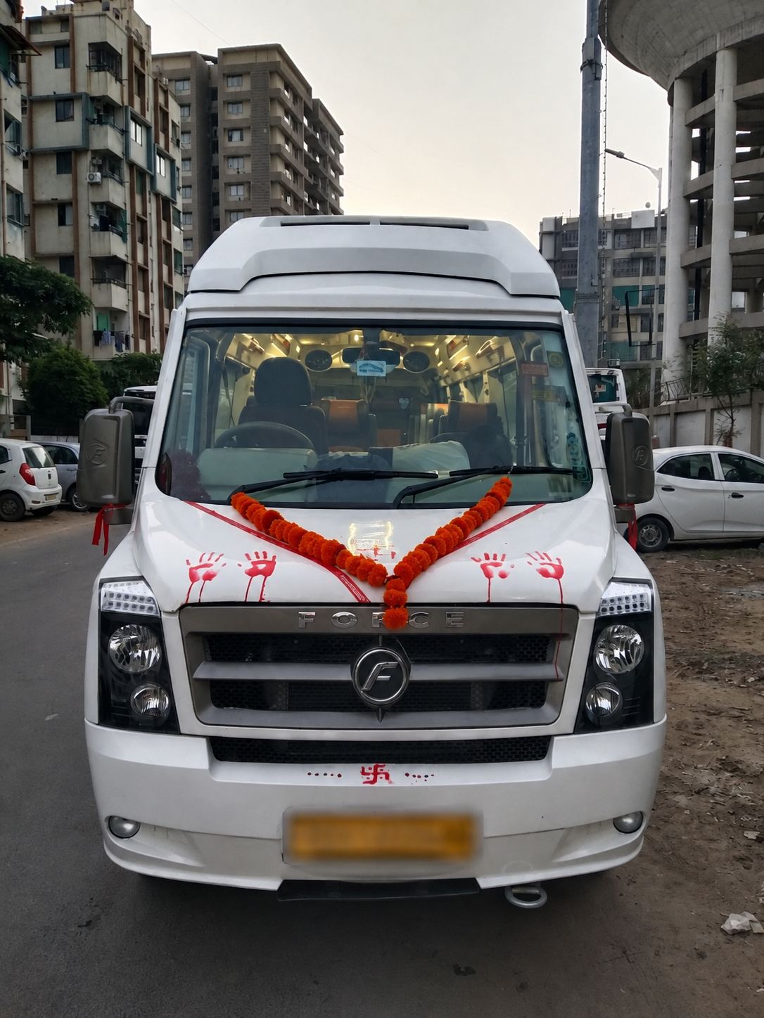 Tempo Traveller decorated for a pilgrimage trip from Ahmedabad